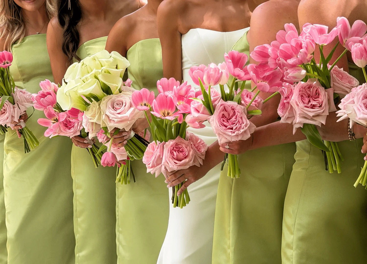 A wedding party celebrating together outdoors